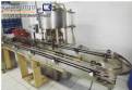 Envasadora rotativa com 12 bicos � vacuo Wada